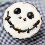 Pizza sauce, pepperoni, ricotta cheese and black olives make up this fun Nightmare Before Christmas Pizza Dip for Halloween or anytime of year!