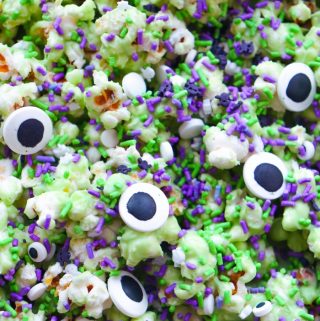 Monsters have never tasted so sweet! This ghoulishly green Monster Popcorn Snack Mix is packed with eyeballs, sprinkles, and spooky charm. Perfect for parties, movie nights, or snacking while haunting the neighborhood!